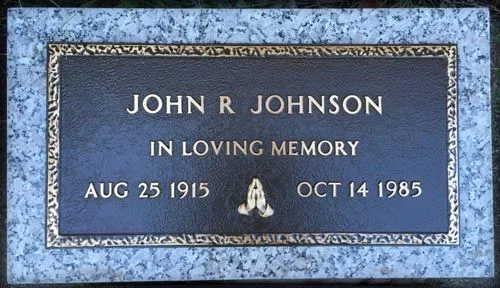 Bronze marker with praying hands on a granite base, John R. Johnson
